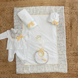 Uscita clinica in cotone con fiocco giallo e stampa floreale